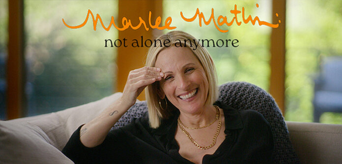 A portrait of Marlee Matlin with the words Marlee Matlin: Not Alone Anymore.
