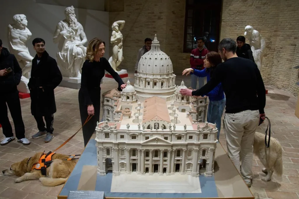 Stefania Terre and Carmine Laezza, both blind, touch a reproduction of St. Peter's Basilica at the Omero Tactile Museum in Ancona, Italy. 