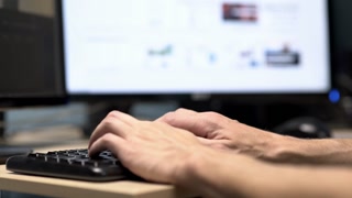 Hands typing on a compter