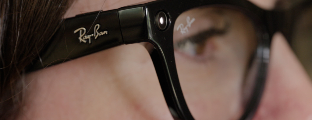 A close-up of Ray Ban Meta glasses on a person's face. 
